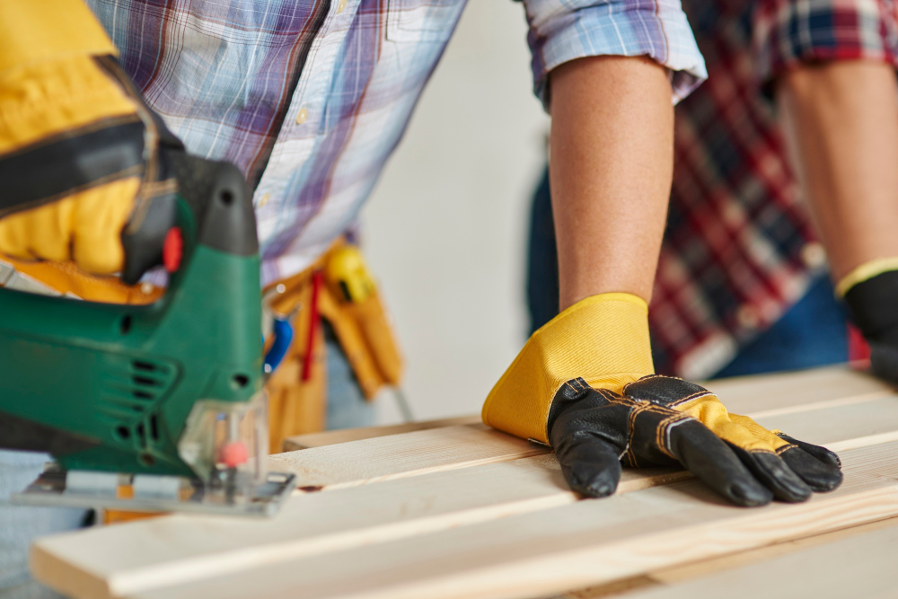 A technician helping install low-maintenance decking for a client
